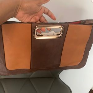 Tan and brown clutch